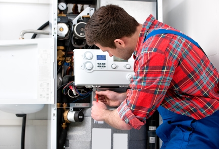 tech repairing boiler system
